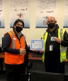 Anthony Pulgado and colleague with the IATA certificate