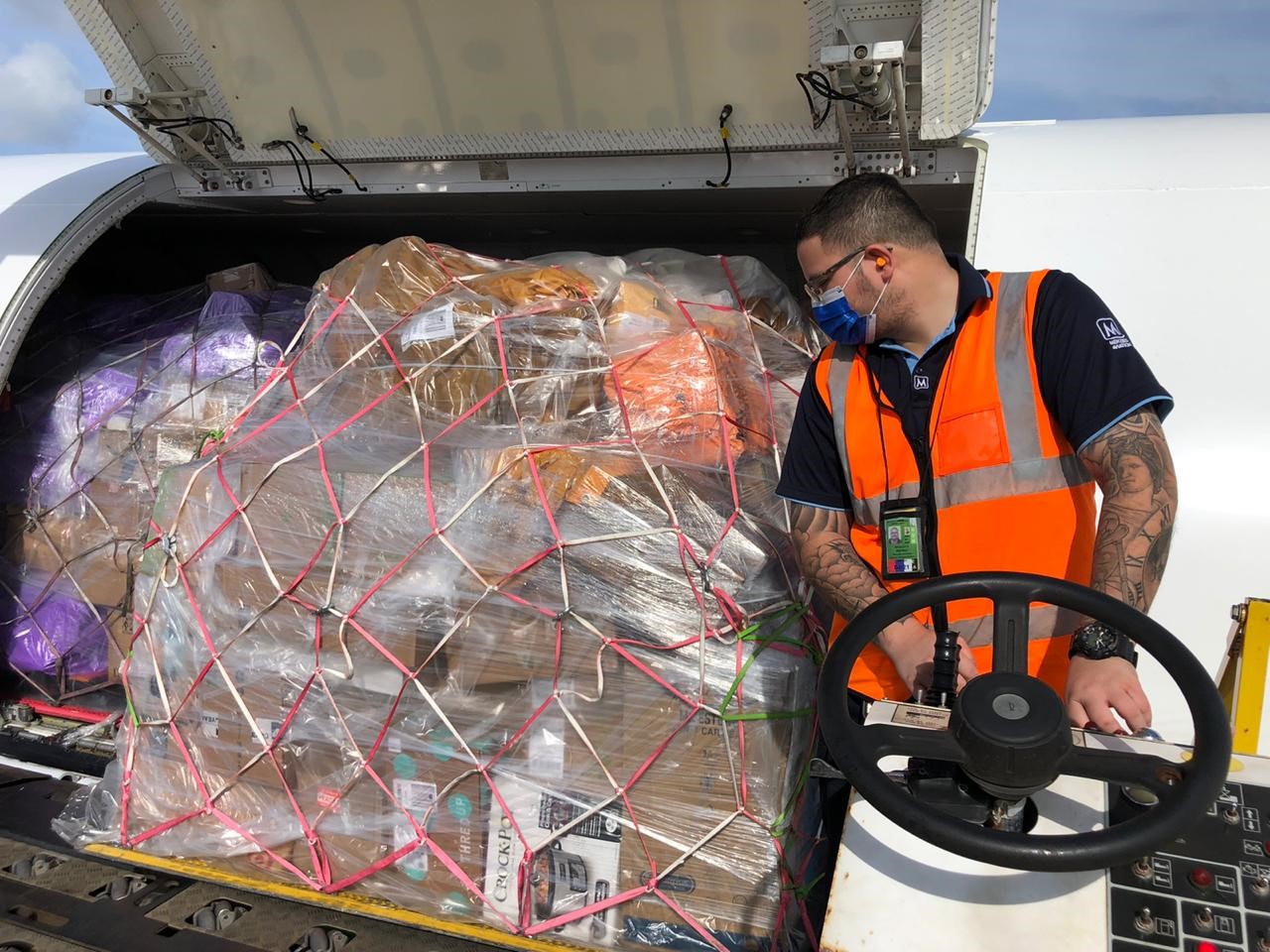 Menzies colleague handling cargo at Guam