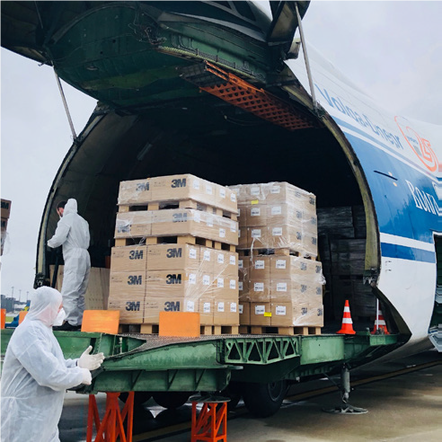 Menzies employees unloading cargo