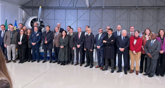 Menzies colleagues join officials for a photo marking the occassion.