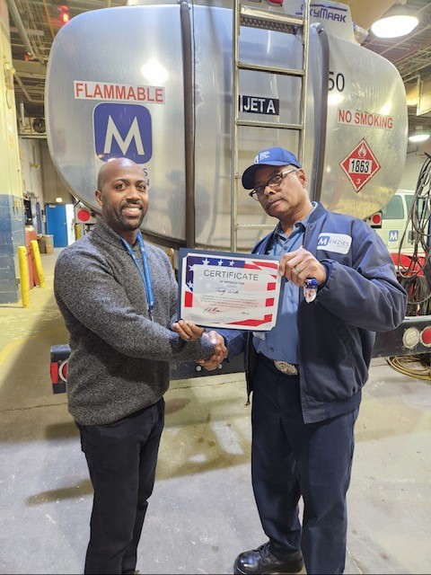 Timothy Willis receiving a certificate