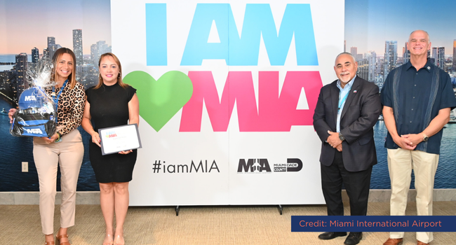 Pictured: Susan Seale (second from left), with her supervisor (far left), Miami-Dade County Chief Operating Officer Jimmy Morales (second from right), and MIA Director and CEO Ralph Cutié.