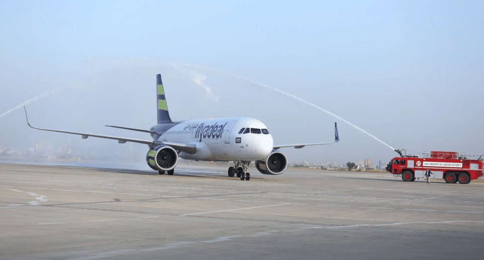 The flyadeal flight is welcomed by airport crews as it arrives in Karachi