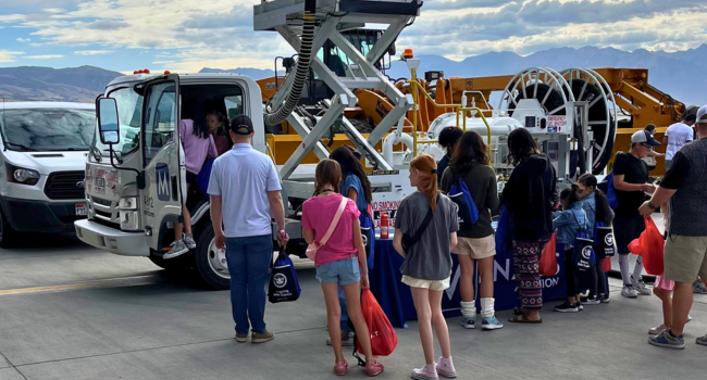 People gather around our Menzies pop-up stand to see some of the fuelling equipment on display. 
